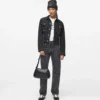 Denim jasje met vetersluiting