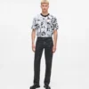 Rechte jeans met monogram over de hele lengte