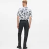 Rechte jeans met monogram over de hele lengte