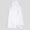 SHIRT MET ÉÉN MOUW EN STRIKDETAIL