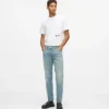 Taps toelopende jeans met verfspatten