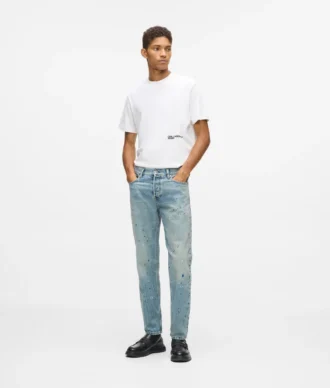 Taps toelopende jeans met verfspatten
