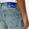 Taps toelopende jeans met verfspatten