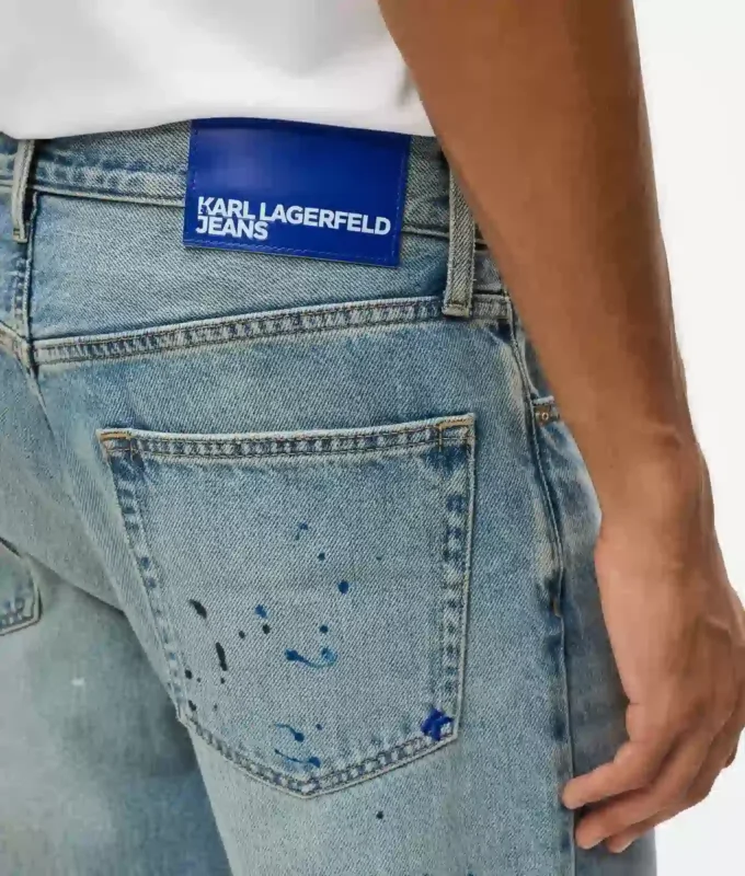 Taps toelopende jeans met verfspatten