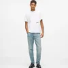 Taps toelopende jeans met verfspatten