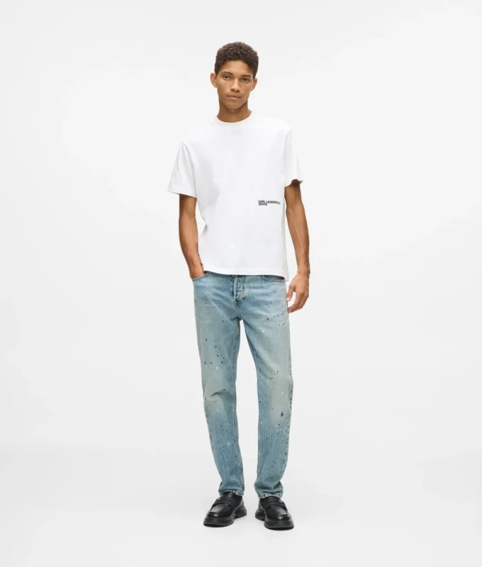 Taps toelopende jeans met verfspatten