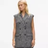 Tweed gilet met paillettenrevers